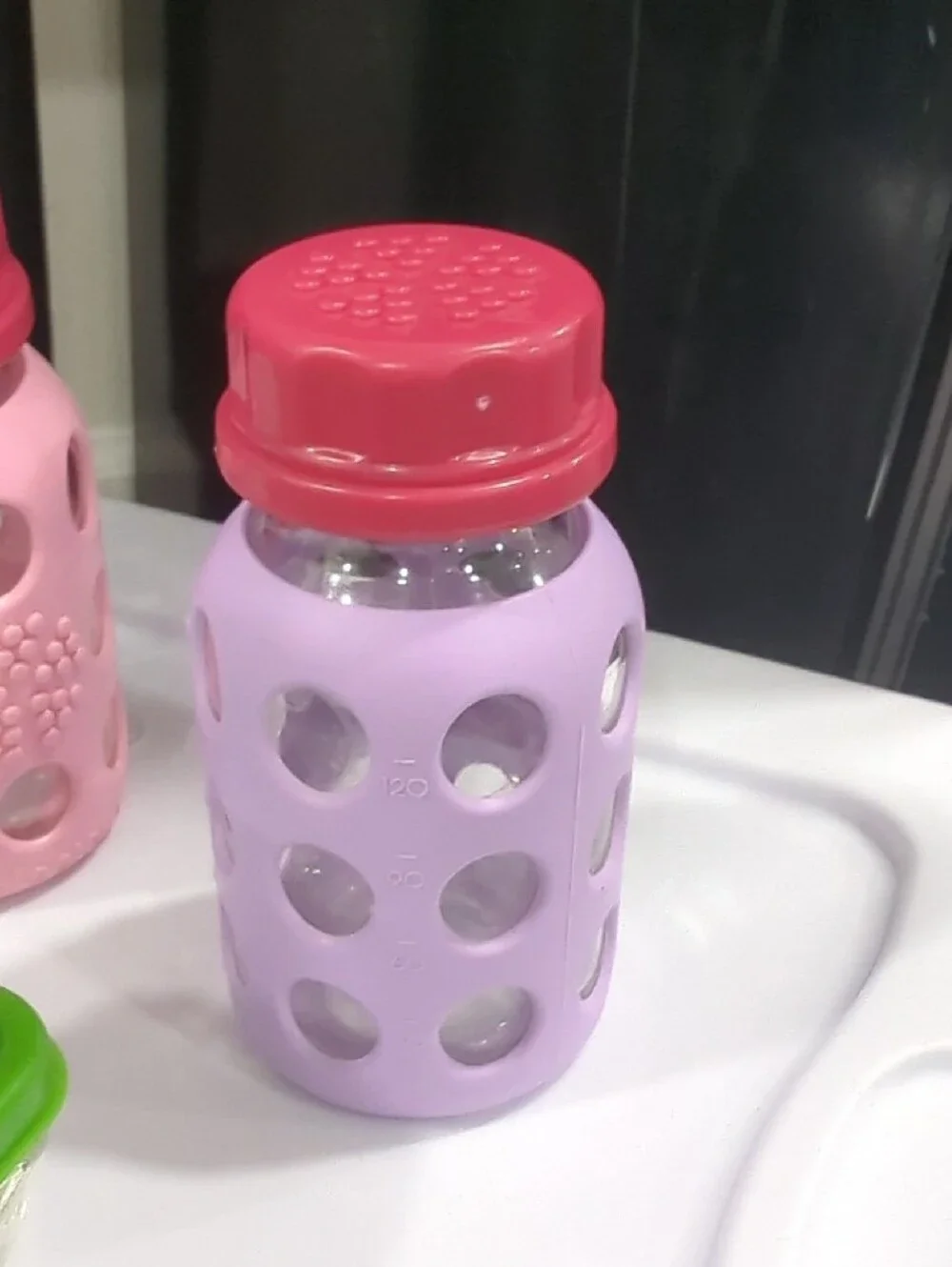 Glass Food Storage Set with Green Lids and Assorted Silicone Bottles